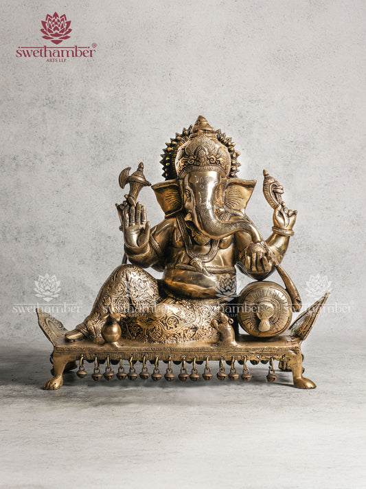 Ganesha Brass idol on sofa